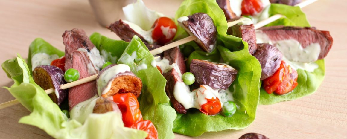 Steak salad boats with little potatoes.