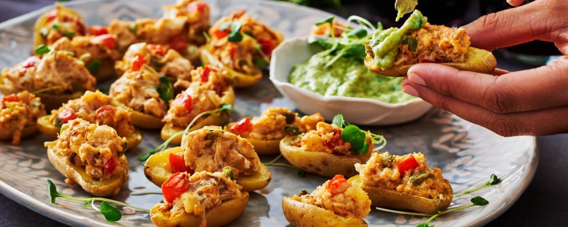 A plate of stuffed potato caps with turkey leftovers.