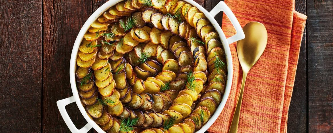 A casserole dish full of tuna potato pie.