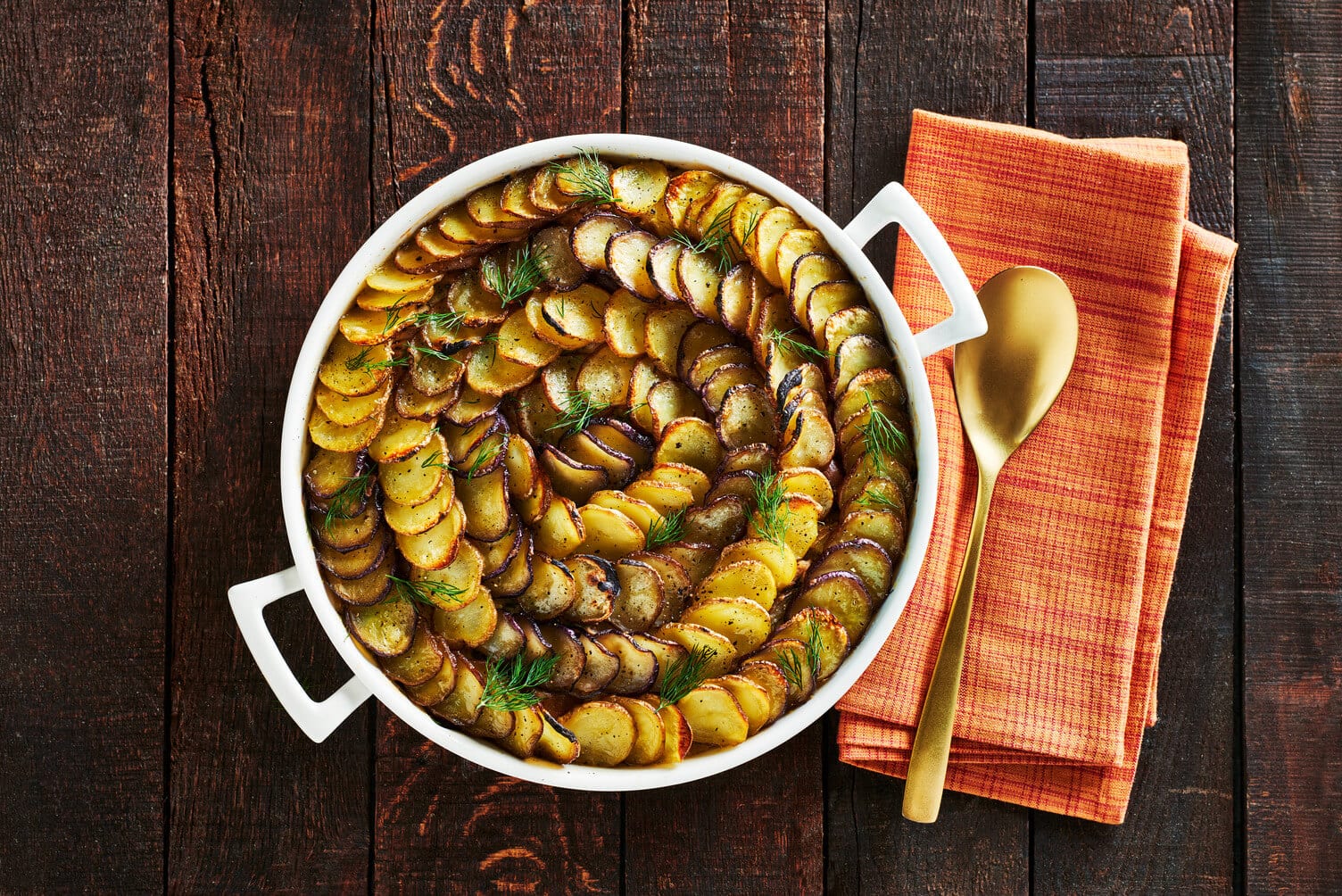 A casserole dish full of tuna potato pie.
