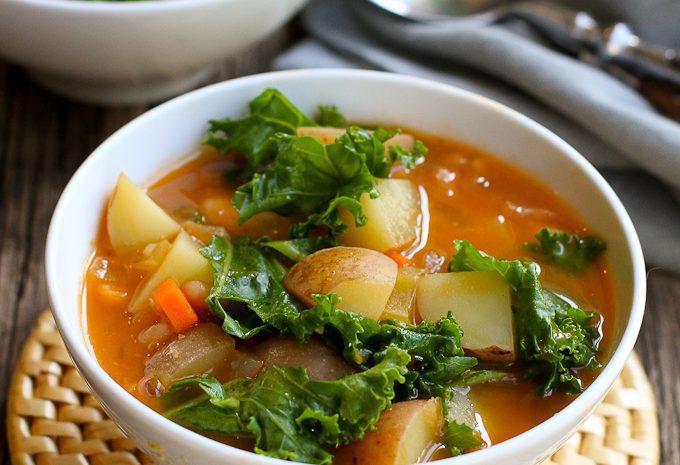 Bowls of potato soup with beans.