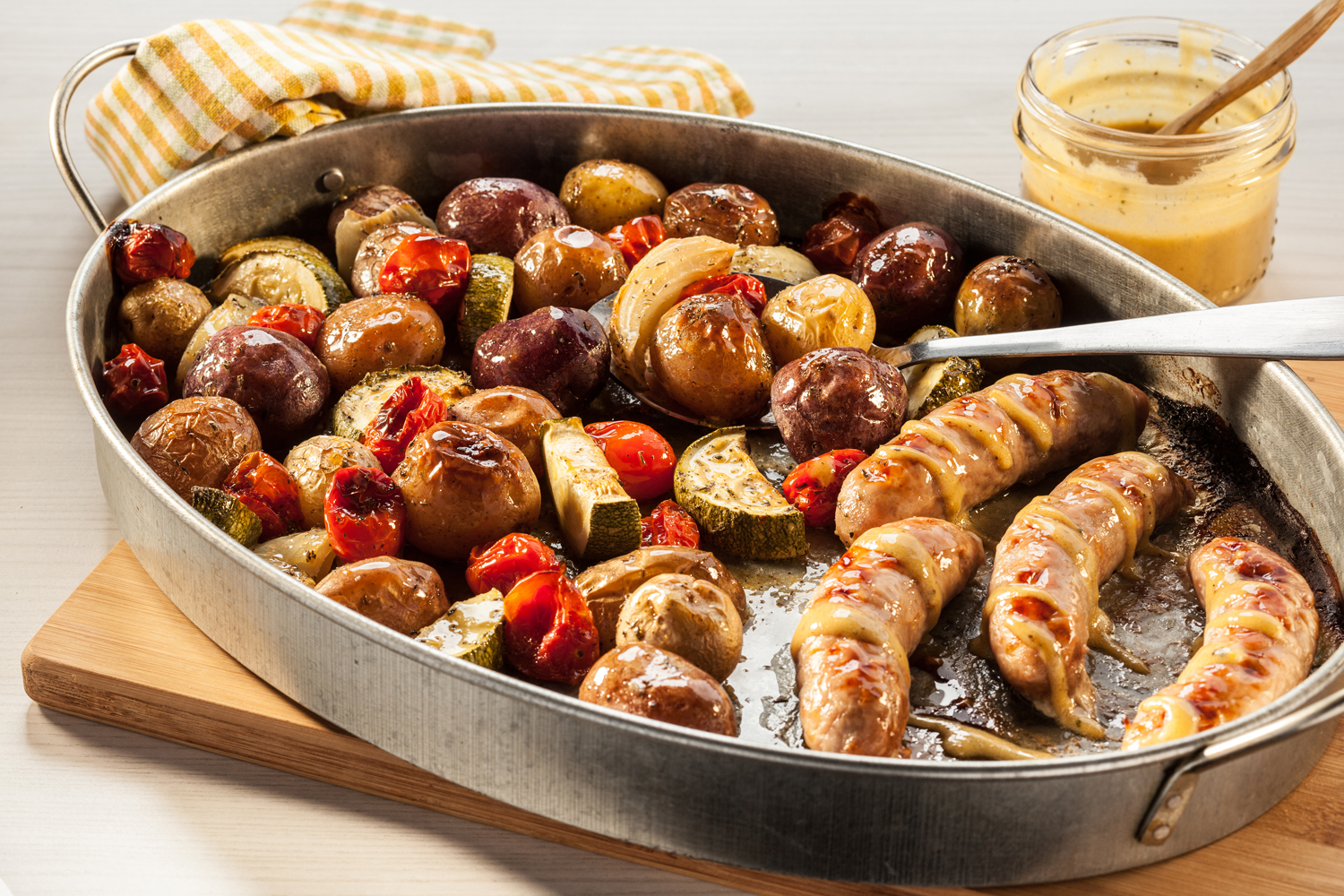 A sheet pan sausage and potato dinner.