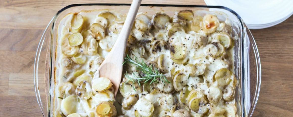 A dish of rosemary goat cheese scalloped potatoes