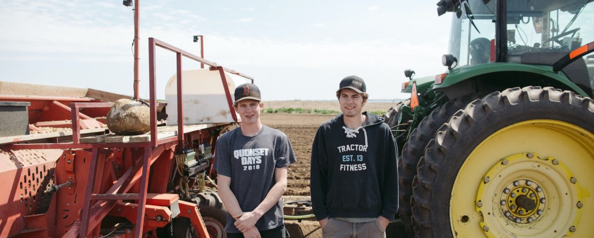 Niek and Ton in front of their tractors.